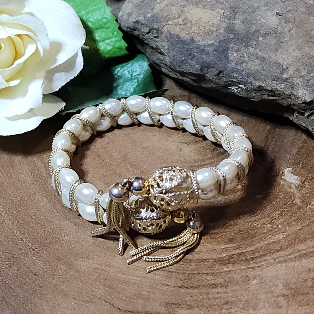 Elegant Bracelet With Gold Toned Accents and Cream Faux Pearl Beads